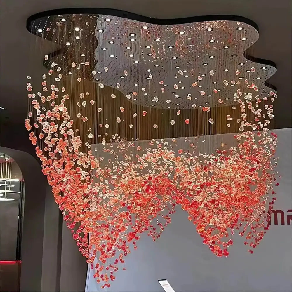 DecorBites™ green crystal stone chandelier with cascading pink and orange glass pieces on a sleek black frame