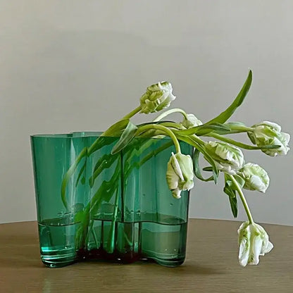 DecorBites green glass vase with a modern segmented design holding white tulips for elegant decor