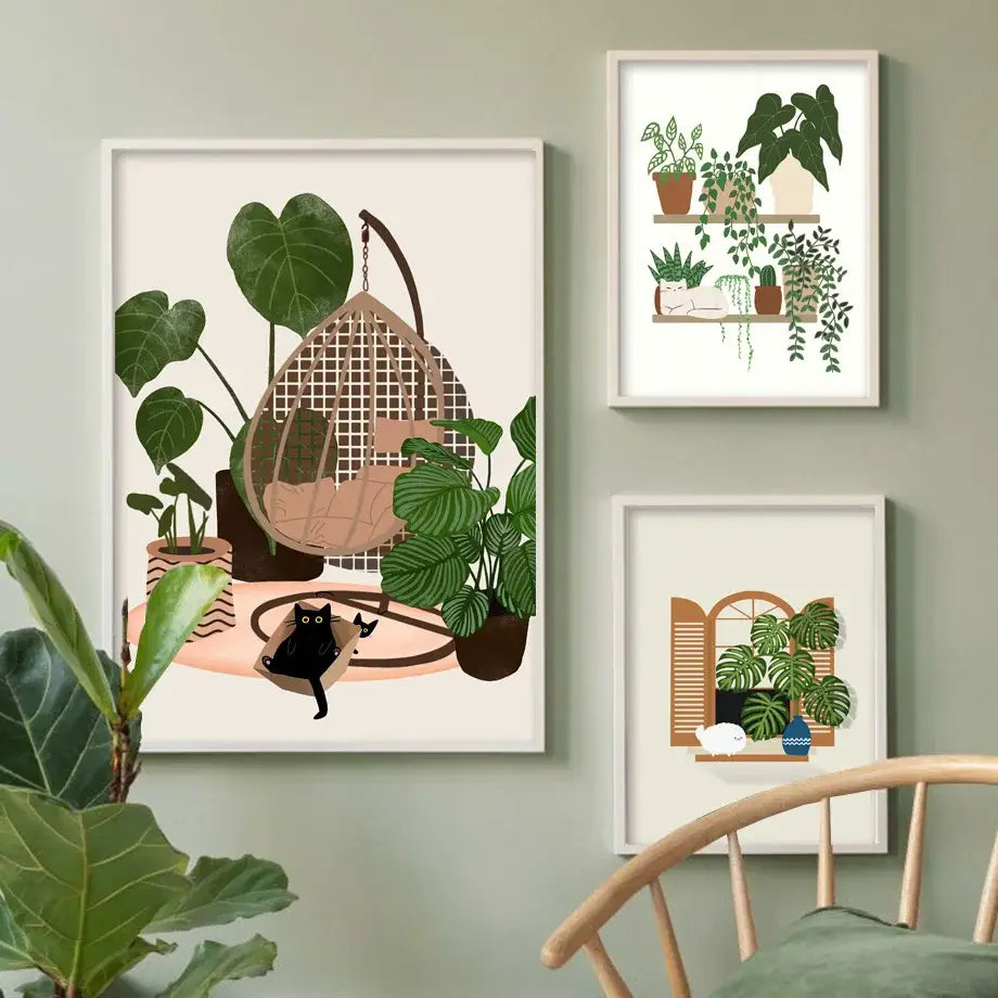 A framed canvas wall art of a woven hanging chair among green plants with a black cat for decorbites green plants black