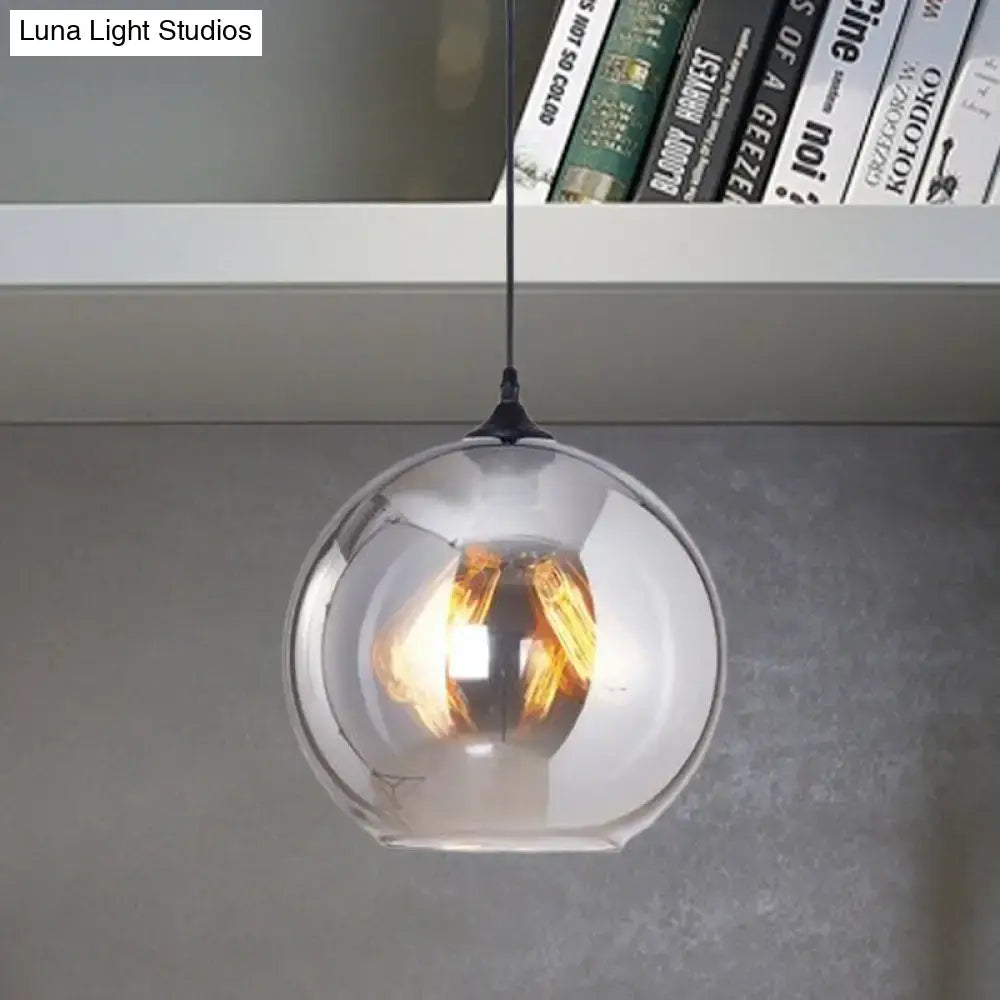 DecorBites™ grey glass pendant light with sleek spherical design and warm-toned bulb base for indoor use