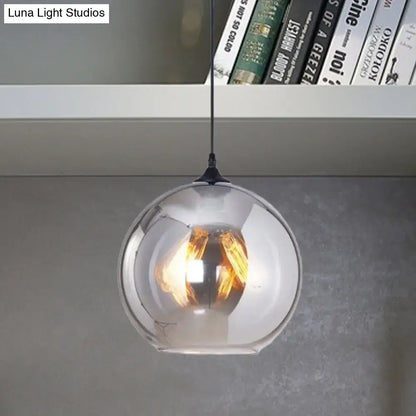 DecorBites™ grey glass pendant light with sleek spherical design and warm-toned bulb base for indoor use