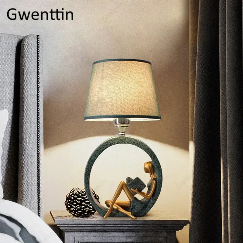 Decorbites guitar girl table lamp with golden seated figurine base and beige fabric shade for bedroom reading light