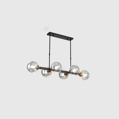 Modern black metal chandelier with five hand-blown dimpled glass globes and gold-toned accents for restaurant use