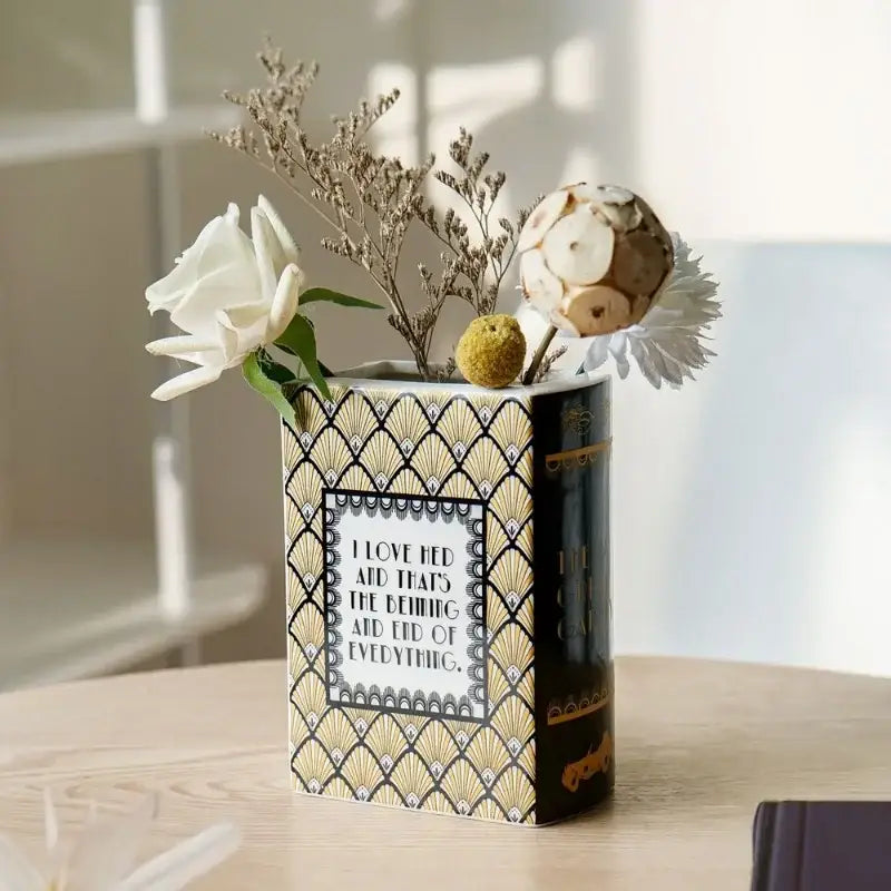A black and gold hand-painted ceramic vase with fan pattern and quote for elegant home decor flower ceramic vase