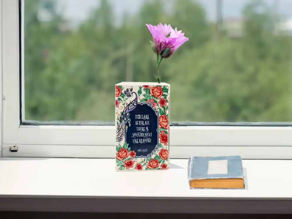 DecorBites™ hand-painted ceramic vase shaped like a book with vibrant red roses and peacock design for home decor