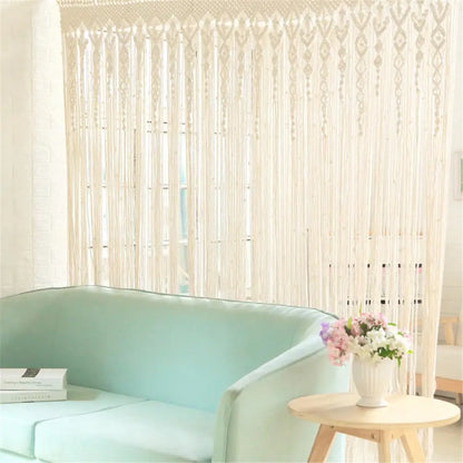 Cream-colored hand-woven macrame door curtain with intricate patterns and tassels for home doorway decor