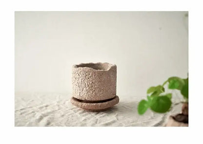 Rustic beige handcrafted ceramic vase with textured speckled surface and matching saucer for flowers by DecorBites™