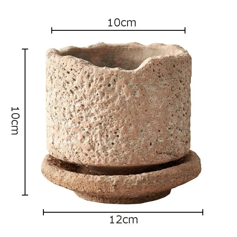 Rustic beige handcrafted ceramic vase with textured porous surface and matching saucer for flowers by DecorBites™