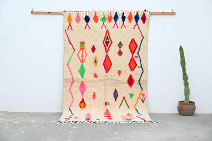 Beige moroccan azilal rug with vibrant pink red green blue and orange geometric patterns handcrafted 246 x 146 cm