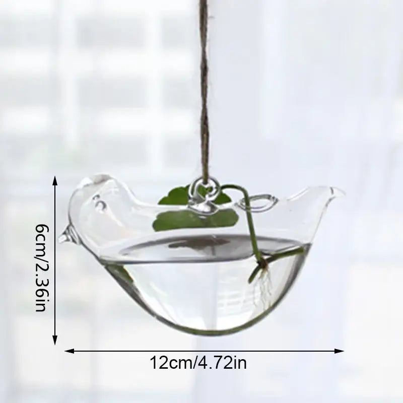Clear glass bird-shaped hanging planter with green leafy plant inside decorbites™ handmade angel glass vase