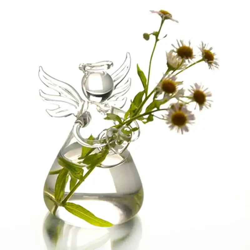 DecorBites™ handmade clear glass angel vase holding delicate white and yellow flowers for home decor