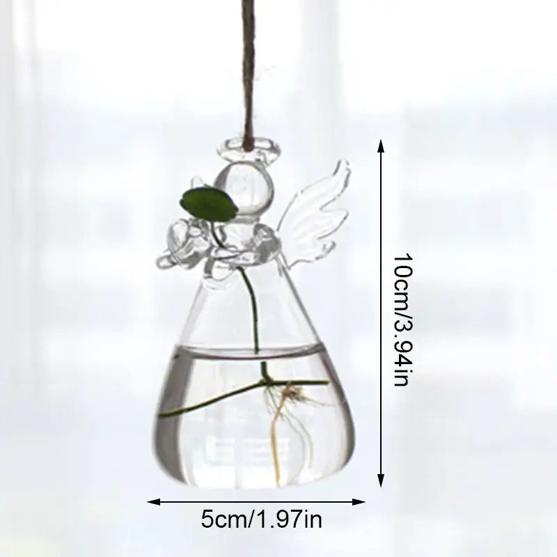 Decorbites™ handmade clear glass angel vase with delicate wings holding plant roots and a small green leaf