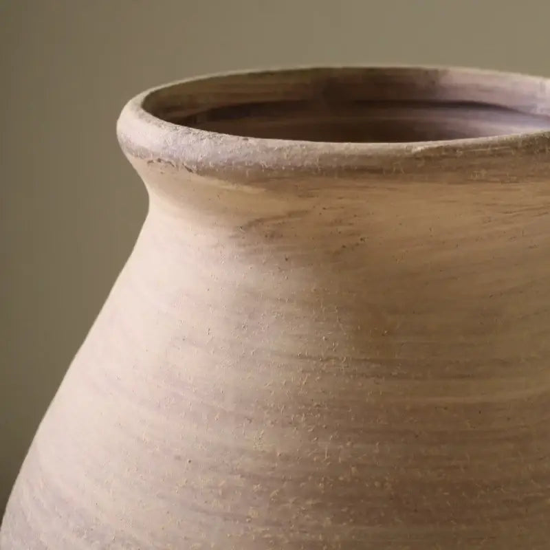 Earthenware ceramic vase with a rounded flared rim and subtle horizontal ridges for handmade home decoration