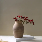 Earthenware handmade ceramic vase by decorbites with subtle ridges and warm beige finish for home decoration
