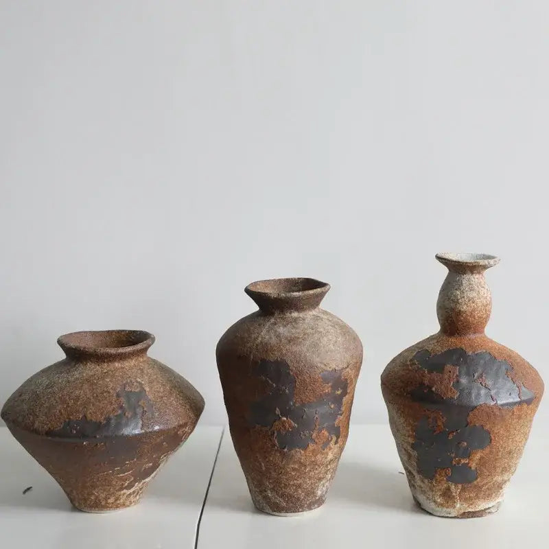 Three rustic handmade ceramic vases by decorbites in earthy brown and dark glaze patches for zen flower arrangements