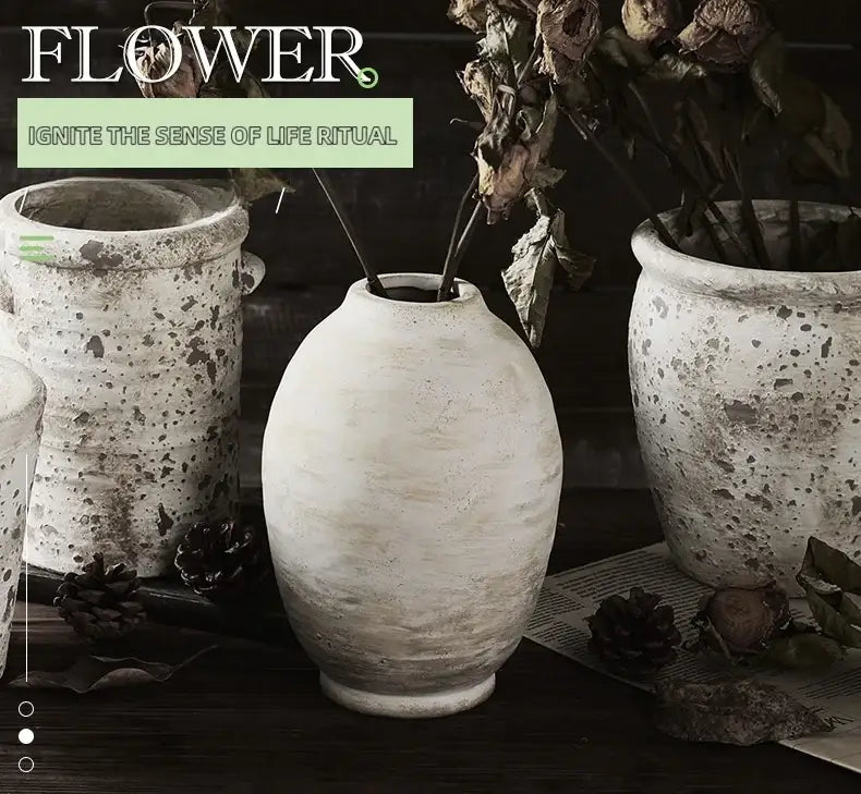 A rustic speckled white handmade ceramic vase with rounded body and narrow neck from decorbites vintage style home decor
