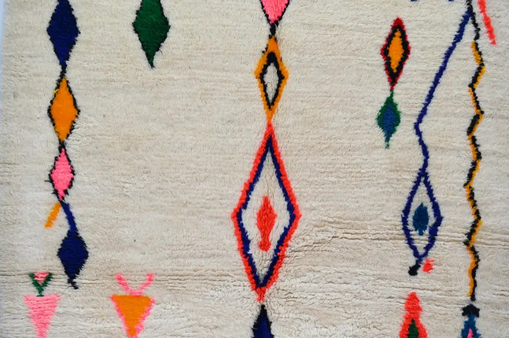 Beige handmade moroccan azilal carpet with vibrant orange pink blue green and red geometric patterns 240x160 cm