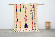Beige DecorBites™ handmade moroccan azilal carpet with vibrant pink blue green and orange geometric patterns 240x160 cm