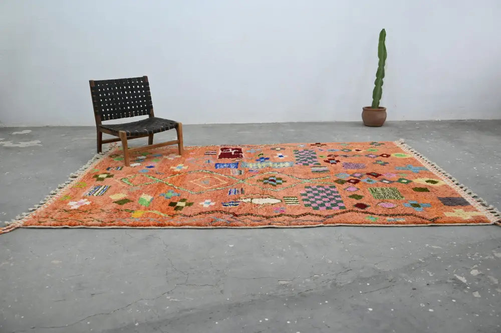 DecorBites™ handmade traditional azilal carpet 305x205 cm vibrant orange with intricate geometric floral patterns and fringed edges