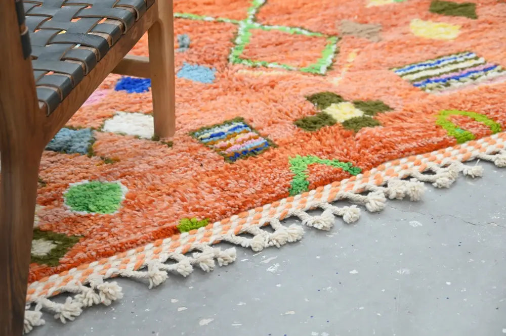 Vibrant orange DecorBites™ handmade traditional azilal carpet with colorful geometric patterns and fringed edge 305x205 cm