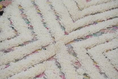 Cream-colored plush woven decorbites™ handmade Moroccan azilal rug 222x133 with textured braided pattern and multicolored accents