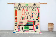 Beige decorbites™ handmade moroccan azilal rug with vibrant colors and natural wool textured geometric patterns