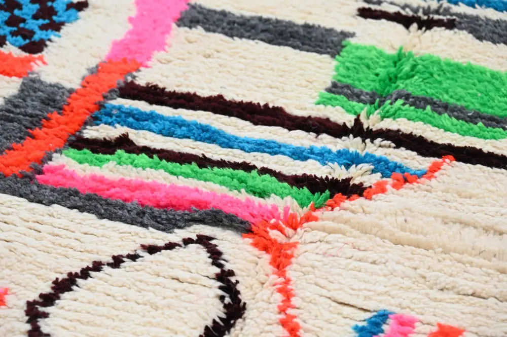 Vibrant decorbites handmade azilal rug with bold geometric stripes in natural wool on cream background 234x161 cm
