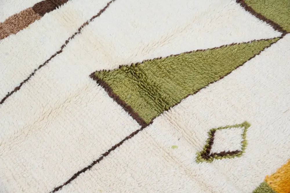 A plush cream-colored decorbites™ handmade traditional azilal rug with olive green and brown geometric patterns 237x146 cm