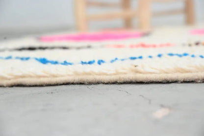 DecorBites™ handmade Moroccan Azilal rug cream-colored wool with vibrant pink and blue bold horizontal stripes 237x155 cm