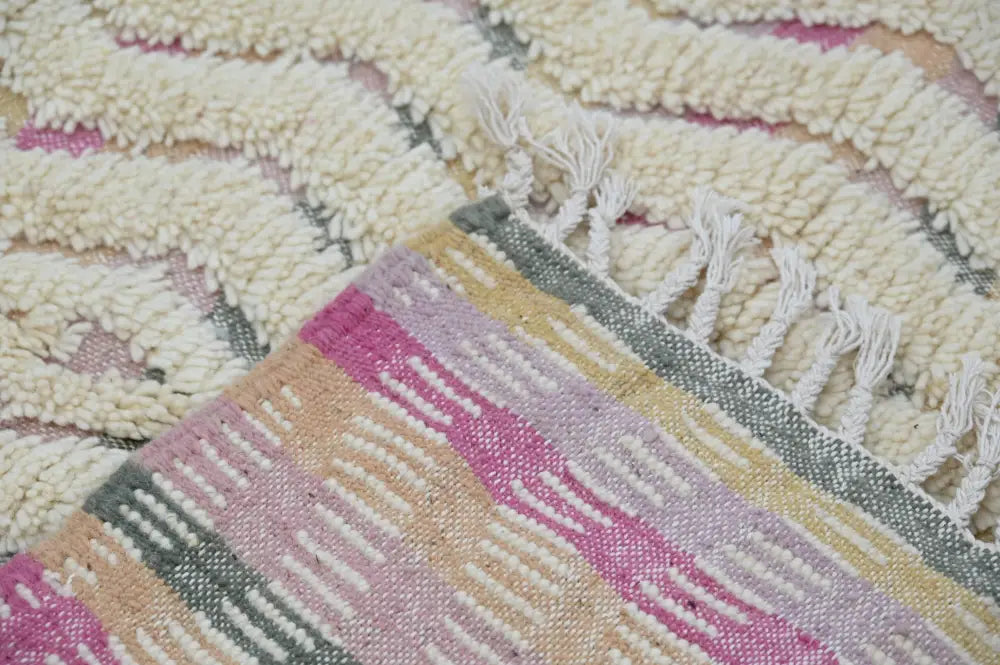 Decorbites handmade moroccan azilal rug 238x144cm featuring soft textured pastel pink cream and muted green stripes with white fringe