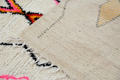 Beige woven azilal rug 240x150cm with bold pink orange black and yellow geometric patterns made of natural wool