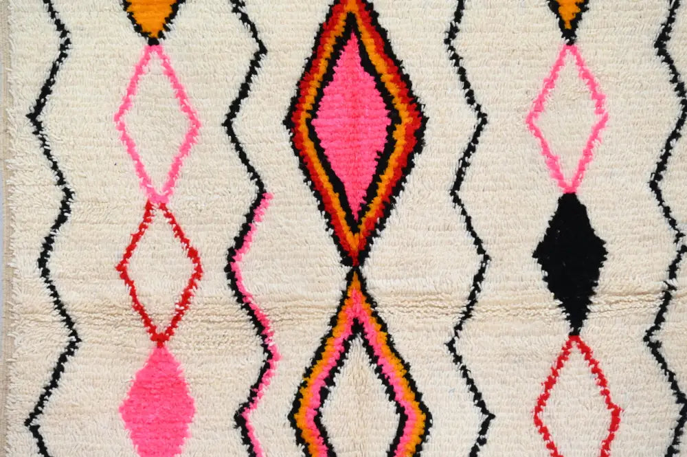 Cream-colored decorbites™ handmade azilal rug 240x150cm with bold geometric patterns in natural wool