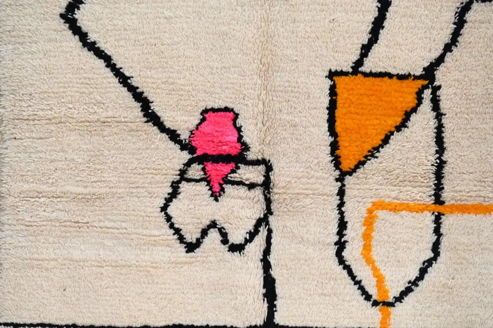 Beige wool moroccan azilal rug with bold black outlines and vibrant pink and orange geometric shapes 240x152 cm decorbites