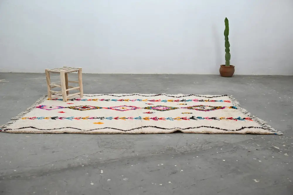 DecorBites handmade moroccan azilal rug 242x150cm with cream base vibrant multicolored geometric patterns and fringed edges