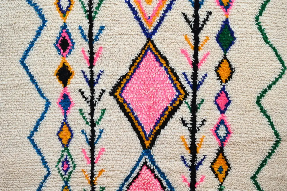 Decorbites handmade moroccan azilal rug 243x131 cm with cream base and bold geometric pink diamond patterns