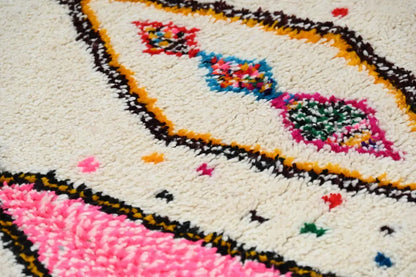 DecorBites™ handmade moroccan azilal rug 245x146 cm with a cream base and bold pink blue green red and black patterns