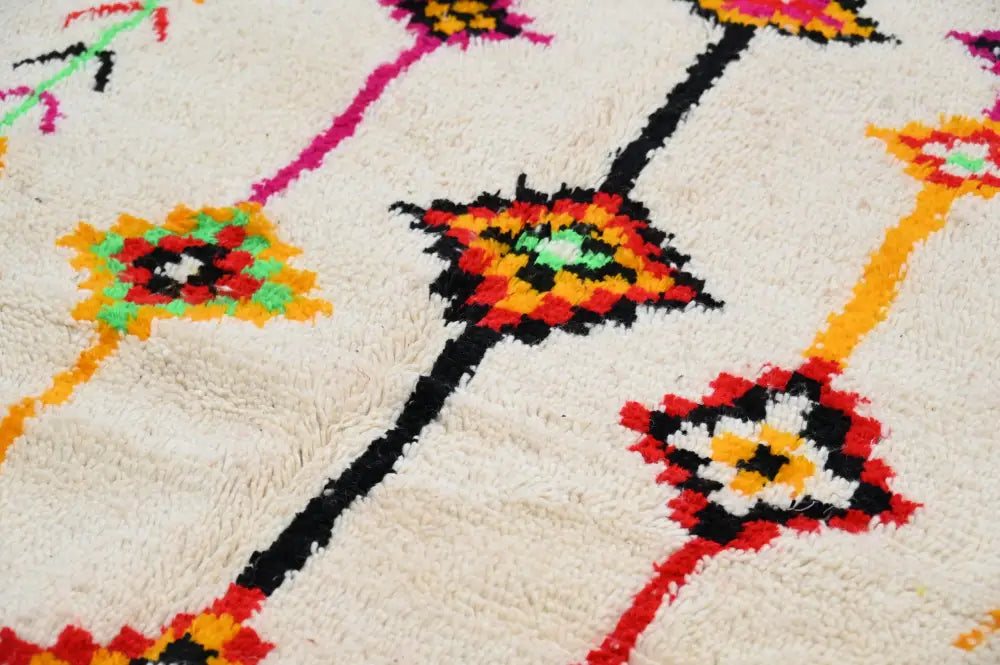 Cream-colored plush wool handmade moroccan azilal rug with vibrant geometric floral patterns 246x146 cm