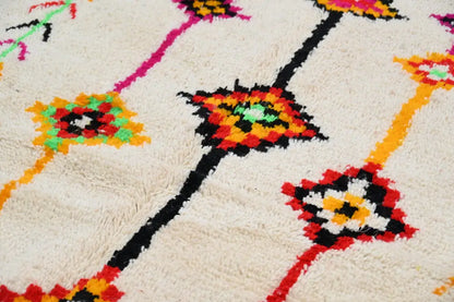 Cream-colored plush wool handmade moroccan azilal rug with vibrant geometric floral patterns 246x146 cm