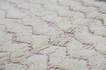 Cream-colored handmade traditional azilal rug with a plush texture and subtle pink geometric pattern 250x143cm