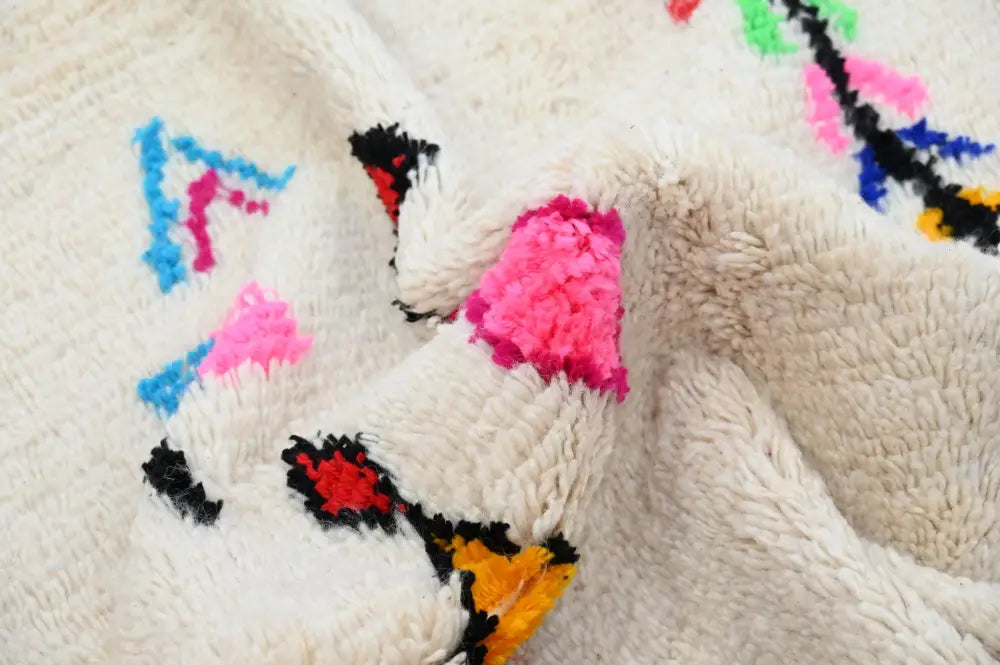 Decorbites™ handmade moroccan azilal rug 250x145 cm with plush off-white base and vibrant pink blue black yellow patterns