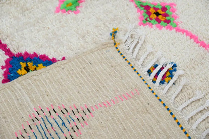 DecorBites™ handmade moroccan azilal rug with cream base, vibrant geometric patterns, and fringed edges 250x148 cm