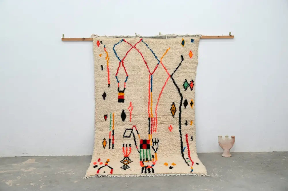 Beige moroccan azilal rug with colorful red blue orange and black geometric patterns handmade 250x154cm by DecorBites