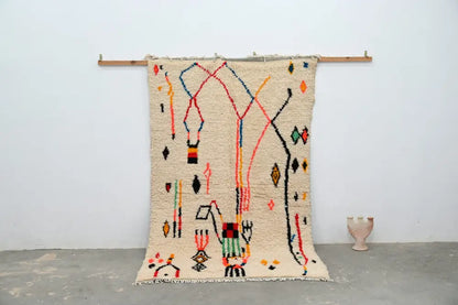 Beige moroccan azilal rug with colorful red blue orange and black geometric patterns handmade 250x154cm by DecorBites