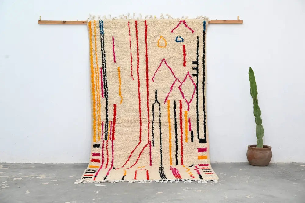 Beige DecorBites™ handmade traditional azilal rug with vibrant red orange yellow black and blue geometric patterns 253x144 cm fringe edge