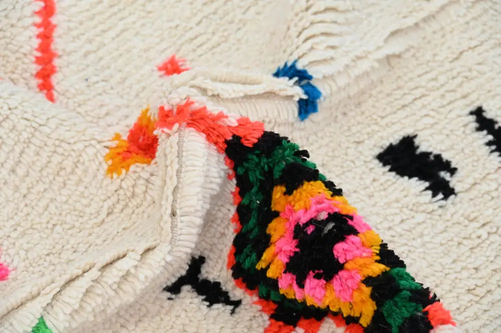 Vibrant decorbites handmade moroccan azilal rug in natural wool with cream base and bold geometric patterns