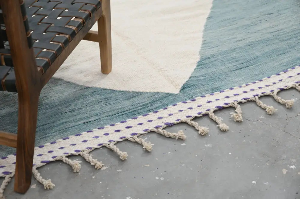Decorbites™ handmade moroccan azilal rug in teal and cream with white rope border featuring purple accents natural wool