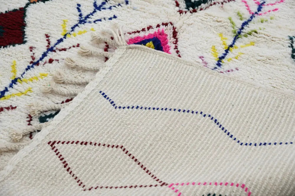 Decorbites™ handmade cream-colored moroccan azilal rug with vibrant pink blue yellow and red geometric patterns 293x206cm