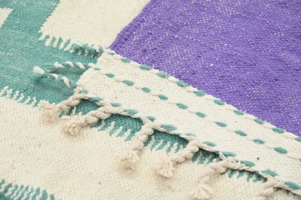 Handwoven DecorBites™ moroccan azilal rug with geometric pattern in cream teal and purple hues 294x175 cm