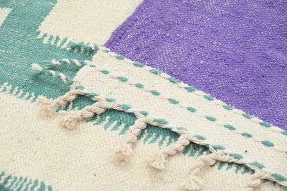 Handwoven DecorBites™ moroccan azilal rug with geometric pattern in cream teal and purple hues 294x175 cm
