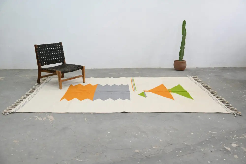 Cream-colored moroccan handmade azilal rug with geometric orange gray and green patterns 300x192 cm by decorbites